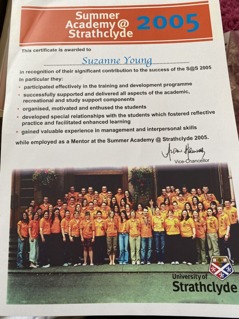 Certificate awarded to Suzanne Young for her role as a mentor at the University of Strathclyde Summer Academy 2005, recognising her contribution to training, student development, and discovery-based learning. Group photo of mentors in orange shirts, marking the beginning of Sooz Young’s journey toward becoming a digital skills leader and founder of Technology Coaching